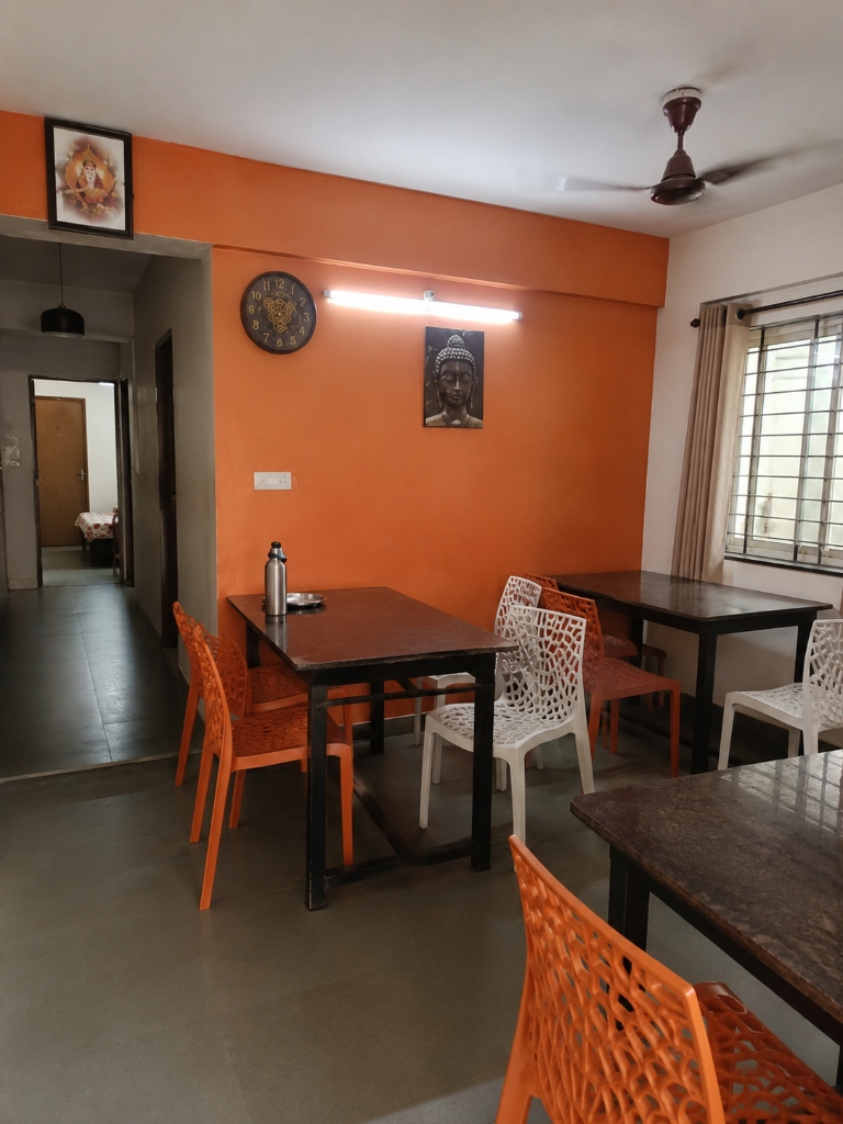 Well-lit dining hall with home-cooked meals served daily